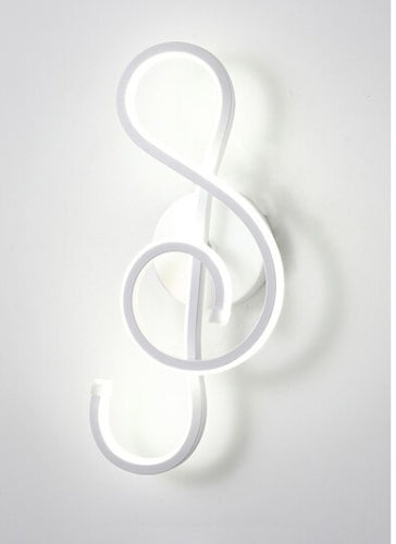 The Note Curved LED Wall Sconce in matte white, cool light
